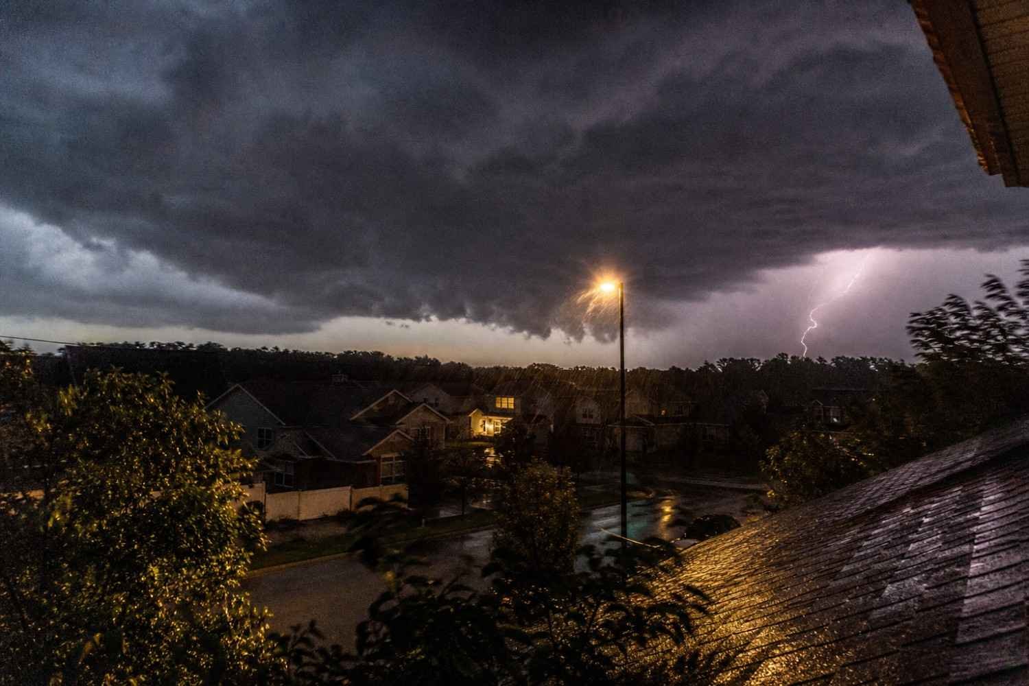 Lightning storm over a suburban Wheaton, IL neighborhood causing storm water damage to homes